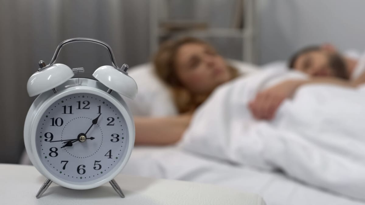 Watch couple find out hilarious reason they keep sleeping through