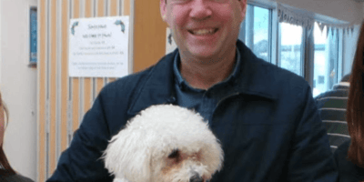Andy Burnham holding his dog Axel
