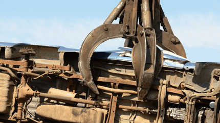 Cars crushed at auto salvage