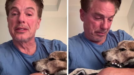 John Barrowman holding dog who passed away