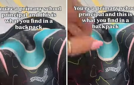 Direktorin öffnet den Schüler-Rucksack