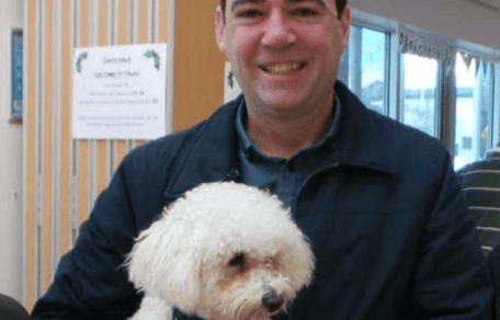 Andy Burnham holding his dog Axel