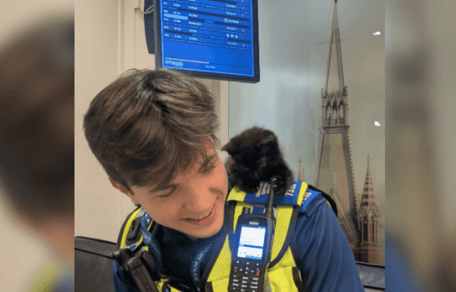 British Transport Police officer with a black and white kitten
