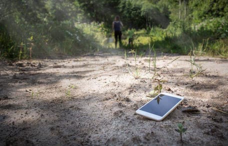 A lost mobile phone lying on the ground