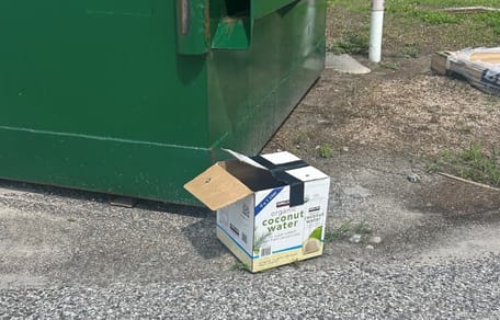 An abandoned box in front of a shelter