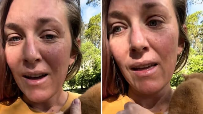 Frau findet Karton am Straßenrand