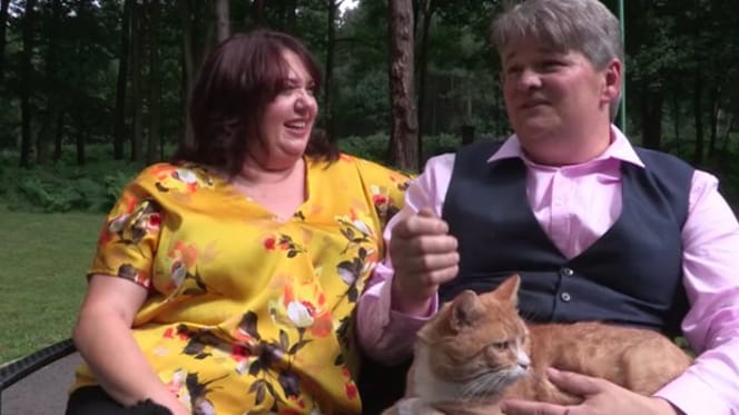Couple with a ginger cat