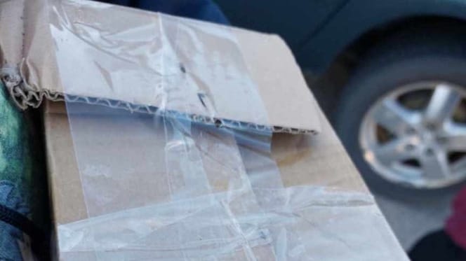 A cardboard box taped shut