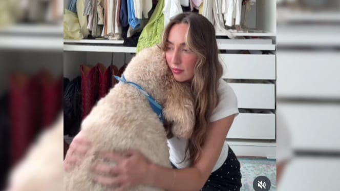 Woman hugging Goldendoodle
